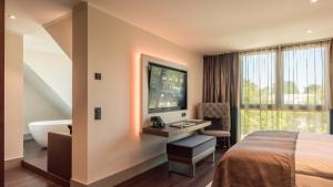 Postel nebo postele na pokoji v ubytování Innspire Hotel