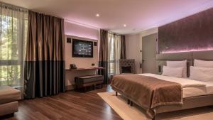 Postel nebo postele na pokoji v ubytování Innspire Hotel