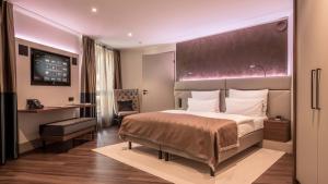 Postel nebo postele na pokoji v ubytování Innspire Hotel
