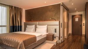 Postel nebo postele na pokoji v ubytování Innspire Hotel