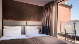 Postel nebo postele na pokoji v ubytování Innspire Hotel