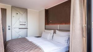 Postel nebo postele na pokoji v ubytování Innspire Hotel