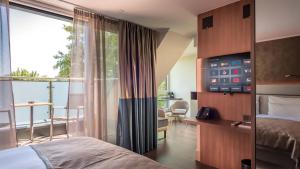 Postel nebo postele na pokoji v ubytování Innspire Hotel