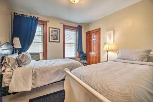 A bed or beds in a room at Historic Apartment - Half Mi to Lake Champlain!