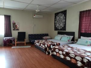 Postel nebo postele na pokoji v ubytování D'Hartamas Guesthouse