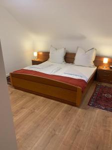 A bed or beds in a room at Gästehaus Melitta