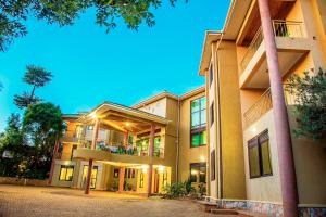 an exterior view of an apartment building at Victoria View Boutique Hotels Kigo in Entebbe