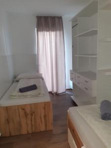 Posteľ alebo postele v izbe v ubytovaní Beach Home