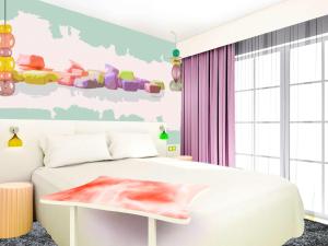 Säng eller sängar i ett rum på ibis Styles Fréjus St Raphael