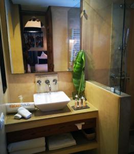 a bathroom with a sink and a mirror at Riad Kalaa in Rabat