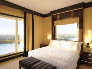 Ein Bett oder Betten in einem Zimmer der Unterkunft Fairmont Nile City