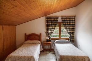 מיטה או מיטות בחדר ב-Casa Fontanals
