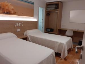 Postel nebo postele na pokoji v ubytování Hotel Iberflat Marynton