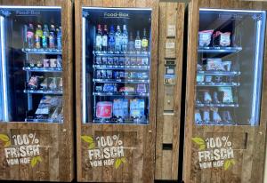 two soda machines with drinks in them at Ferienpark Thüle in Friesoythe