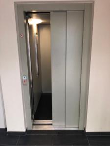 an elevator in a building with the door open at Ferienpark Thüle in Friesoythe