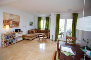 a living room with a couch and a table at Apartment Andrea in Trebinje