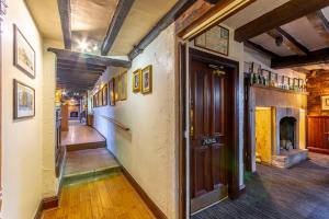 a hallway of an old building with a door at The Forest Lodge in Edwinstowe +63 photos