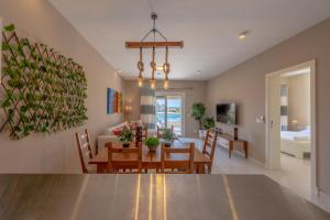 a dining room and living room with a dining table at Joubal 3BR Villa Private Pool next to Marina in Hurghada
