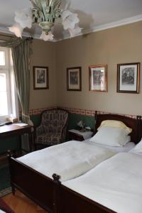 سرير أو أسرّة في غرفة في Villa Bomberg