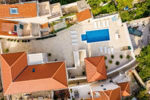 an overhead view of a house with orange roofs at Residence & Pool Villa Schwarz Suites in Cavtat