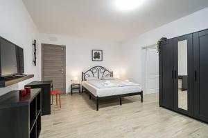 Säng eller sängar i ett rum på Residence & Pool Villa Schwarz Suites