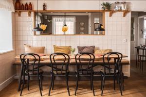 a kitchen with a table and four chairs at Fanø Krogaard in Fanø