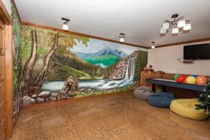 TV a/nebo společenská místnost v ubytování Guest house М