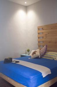 מיטה או מיטות בחדר ב-Cipta Guesthouse