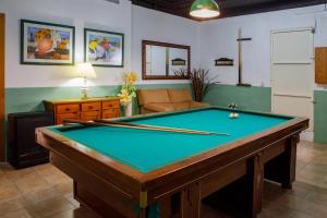 a living room with a pool table in a room at Casa Fontanals in Pla del Panadés