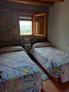 Postel nebo postele na pokoji v ubytování Casa Rural El Boixar - El Mirador