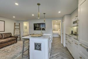 a kitchen and living room with a couch at Aspen Condo with Mountain Views and Ski Access! in Aspen
