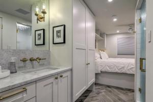 a bathroom with a sink and a bedroom with a bed at Aspen Condo with Mountain Views and Ski Access! in Aspen +19 photos