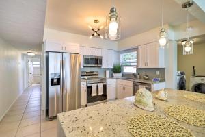 A kitchen or kitchenette at Cute and Cozy Florida Duplex Walk to Beaches!