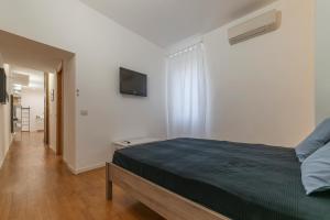 Posteľ alebo postele v izbe v ubytovaní Testaccio & Piazza Liberatrice Apartment