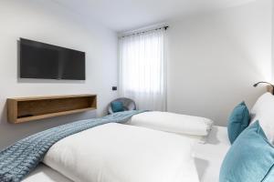 Posteľ alebo postele v izbe v ubytovaní Apartment Ravison