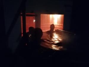 a silhouette of a person in a dark room at Boathouse Balatonlelle with Sauna & Salty Bath Tub in Balatonlelle