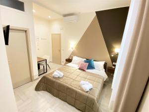 Posteľ alebo postele v izbe v ubytovaní B&B De Nava Suite