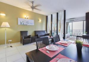 a living room with a dining table and a living room at 5min Mid Valley Southkey 10min KSL CIQ City Square in Johor Bahru
