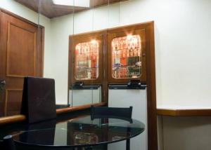 a dining room with a glass table and chairs at Hotel Paraguai (Adult Only) in Rio de Janeiro