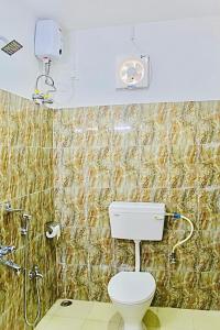 a bathroom with a toilet and a shower at Zcube Andaman in Port Blair