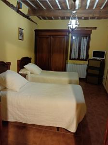 En eller flere senge i et værelse på Casa Rural Marina