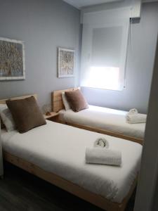 Llit o llits en una habitació de Bilbao Cozy Apartment with free Wifi