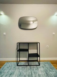 a glass table on a rug in a room at Duque de Loulé in Porto