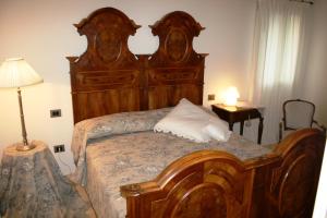 מיטה או מיטות בחדר ב-Casa Di Campagna Castello B&B