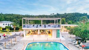 an aerial view of a villa with a swimming pool at Chrousso Village in Paliouri
