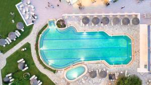 an overhead view of a swimming pool in a resort at Chrousso Village in Paliouri