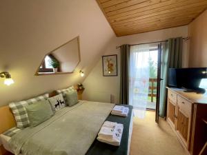 
Łóżko lub łóżka w pokoju w obiekcie Dolina Sarenek

