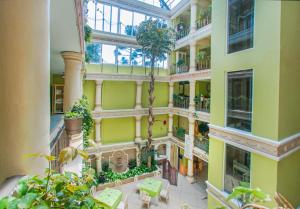 an overhead view of a large building with plants at Villa las Margaritas Plaza Cristal in Xalapa