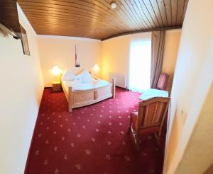 Postel nebo postele na pokoji v ubytování Hotel Restaurant Sidan