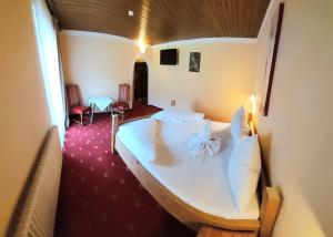 Postel nebo postele na pokoji v ubytování Hotel Restaurant Sidan
